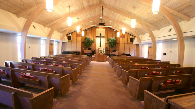 View of pews and altar in church