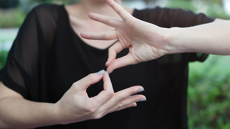 Woman doing sign langauge