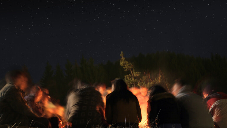 People around camp fire